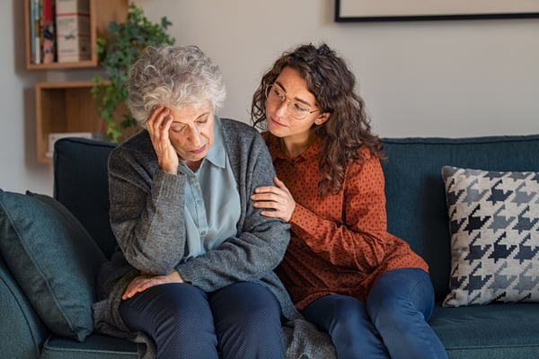 Woman comforting her grandmother